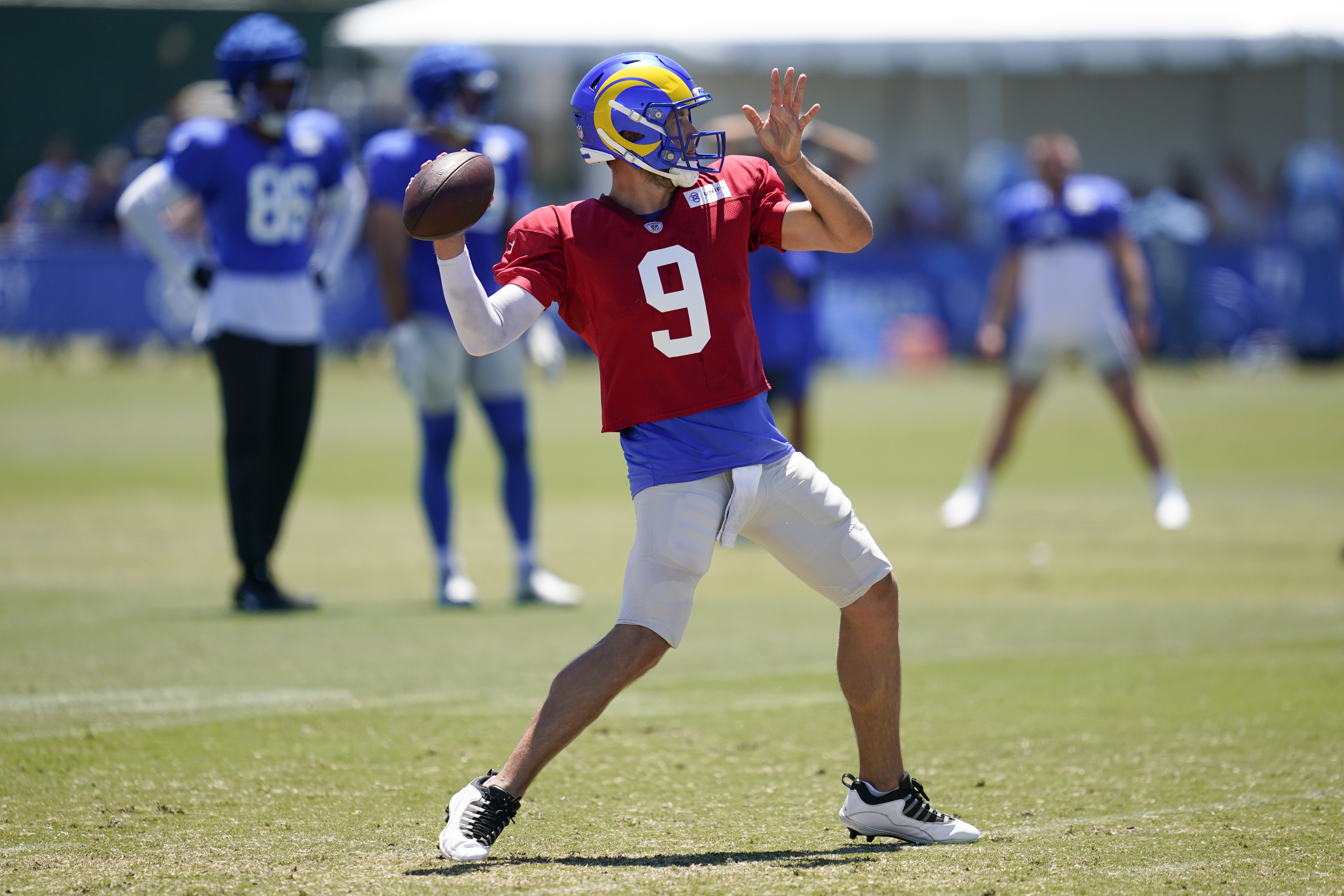 Los Angeles Rams quarterback Matthew Stafford (9) throws a pass during NFL football training camp in Irvine, Calif., Saturday, Aug. 6, 2022. 