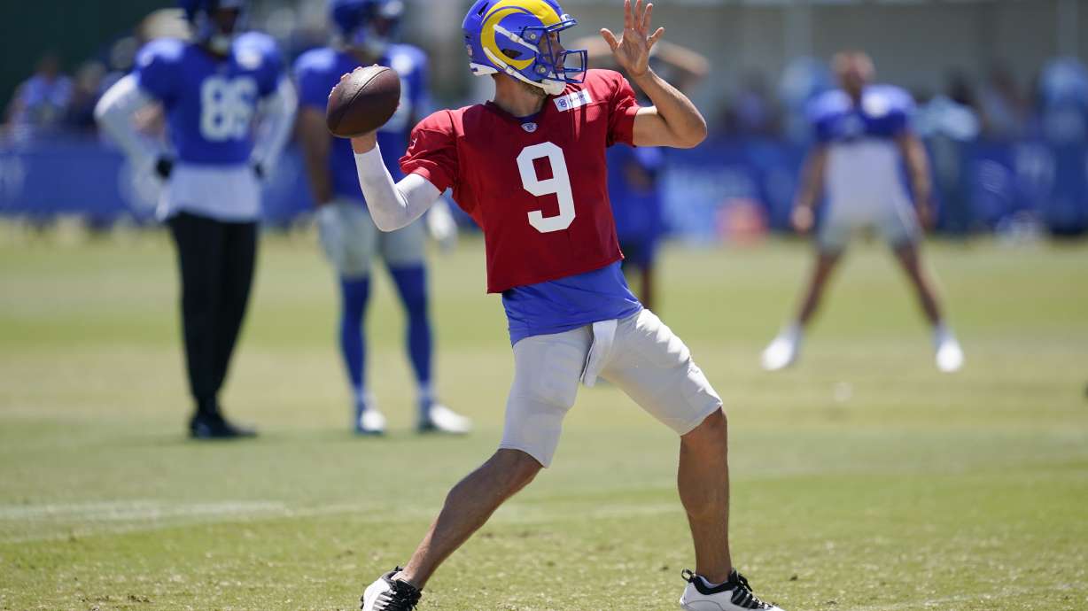 Los Angeles Rams quarterback Matthew Stafford (9) throws a pass during NFL football training camp in Irvine, Calif., Saturday, Aug. 6, 2022.