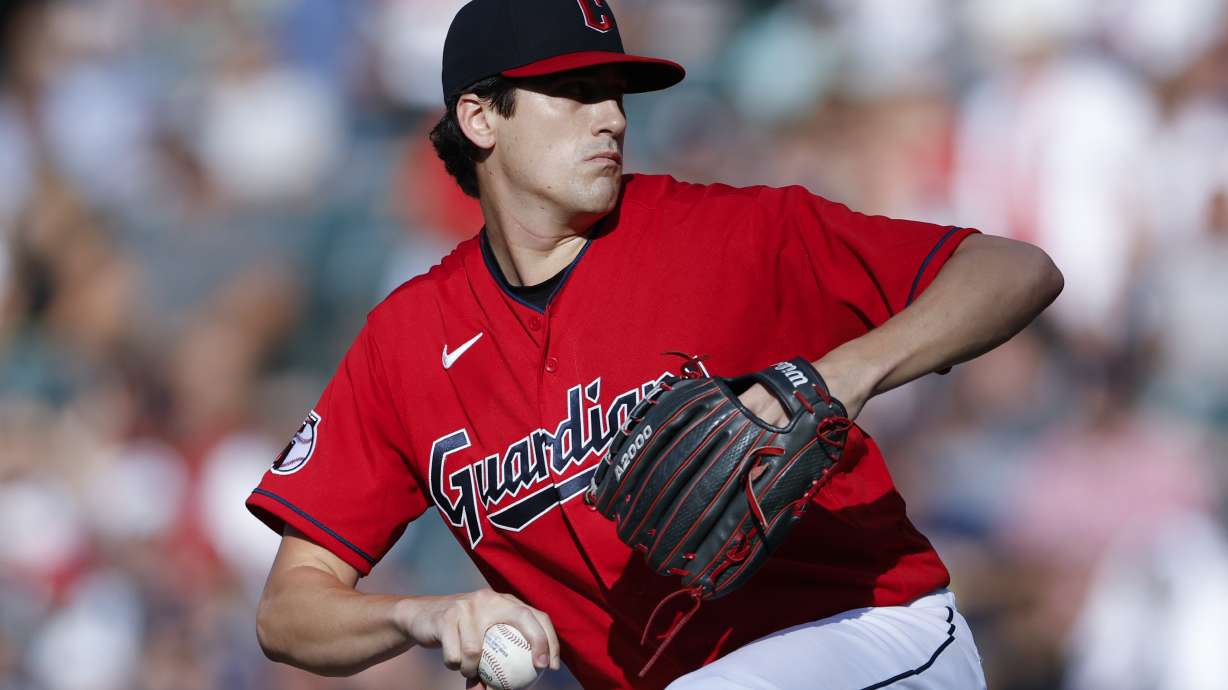 Cleveland Guardians starting pitcher Cal Quantrill winds up during the first inning of the team's baseball game against the Houston Astros, Saturday, Aug. 6, 2022, in Cleveland.