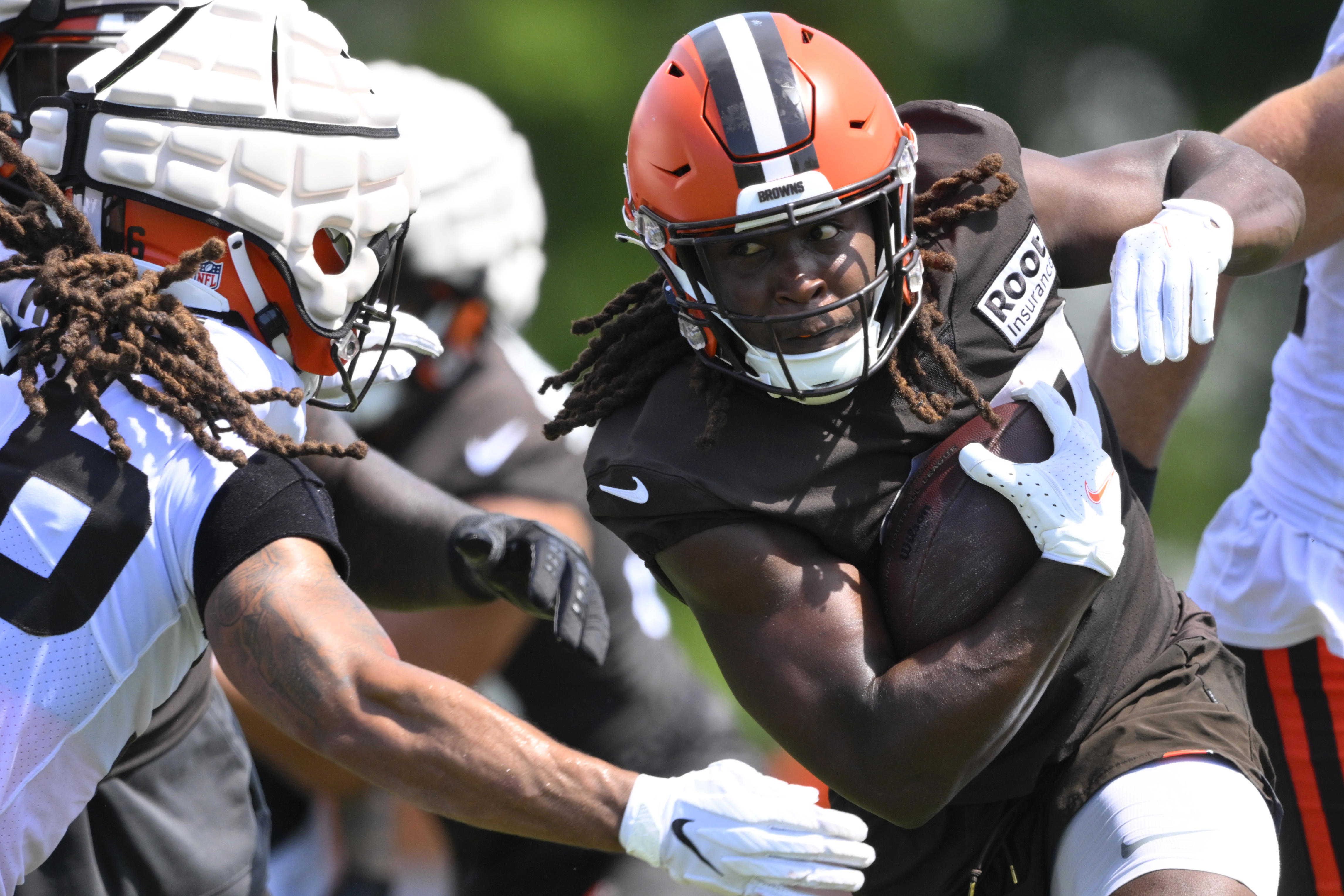 Cleveland Browns running back Kareem Hunt runs with the ball during the NFL football team's training camp Wednesday, Aug. 3, 2022, in Berea, Ohio. 