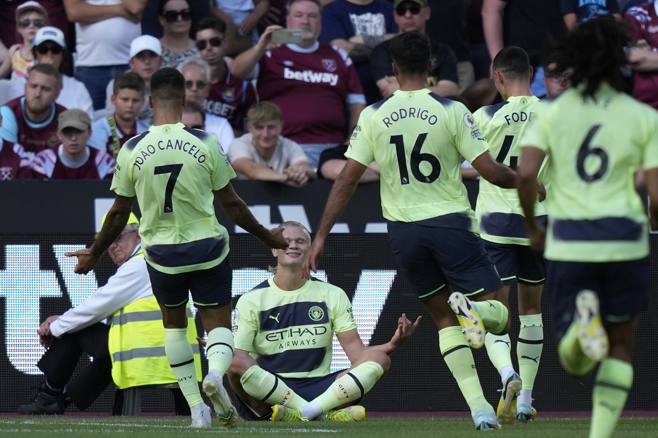 Manchester City's Erling Haaland, 2nd left, celebrates with teammates after scoring his sides first goal during their English Premier League soccer match between West Ham United and Manchester City at the London Stadium in London, England, Sunday, Aug. 7, 2022. 