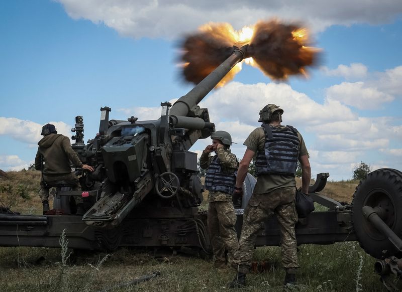 Ukrainian service members fire a shell from a towed howitzer FH-70 at a front line, as Russia's attack on Ukraine continues, in Donbas Region, Ukraine, on July 18.