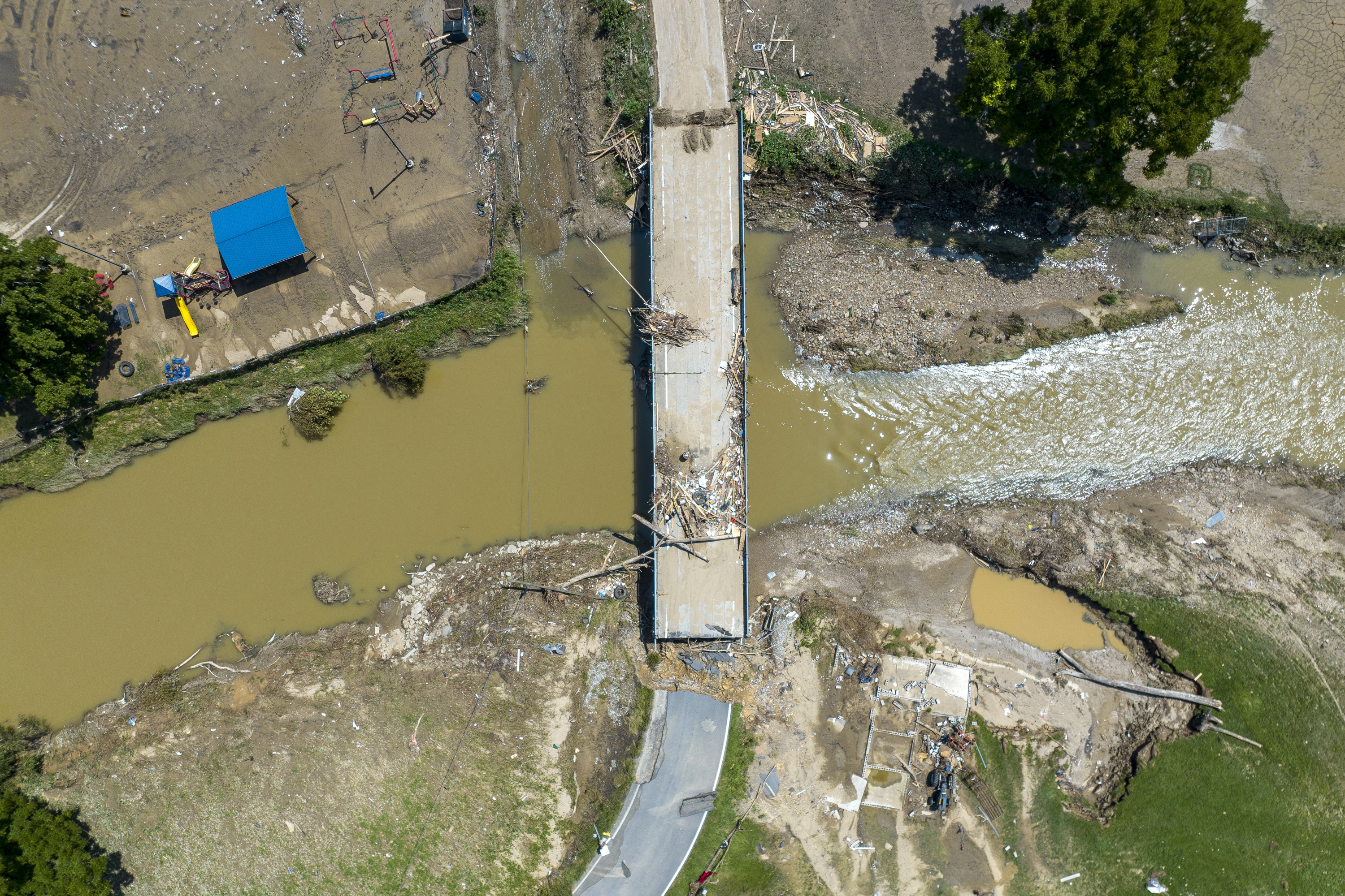 A bridge over Troublesome Creek in Perry County, Ky., remains damaged Aug. 2, following flooding the week before. President Joe Biden and first lady Jill Biden arrived in Kentucky Monday to meet with families who have suffered from historic flooding.