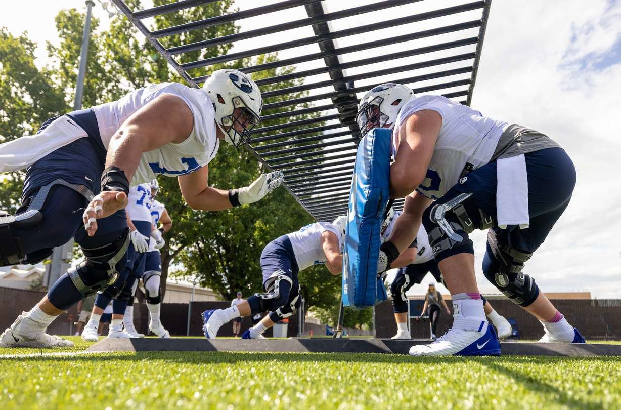 BYU football linemen hit the pads during practice in fall training camp, Aug. 5, 2022 in Provo.