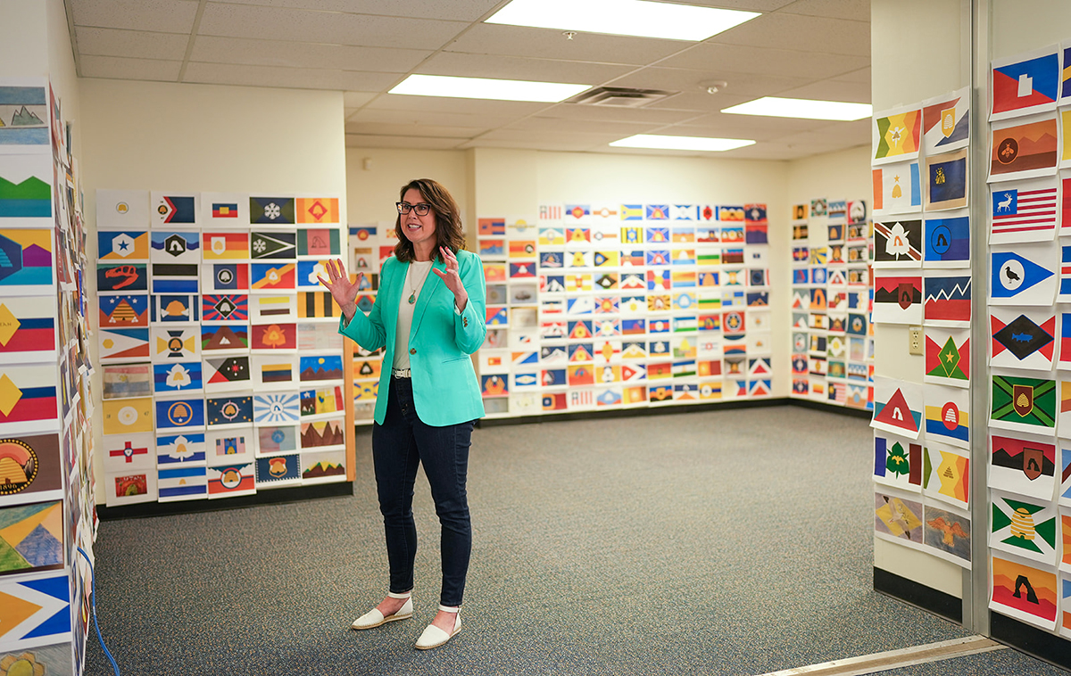 Utah Lt. Gov. Deidre Henderson views flag design submissions during an open house for the Utah State Flag Task Force.