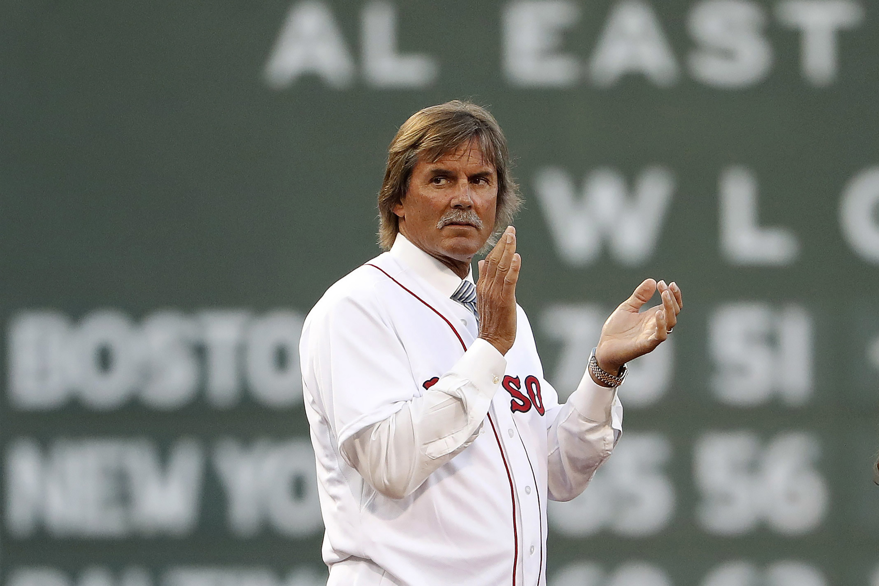 FILE - Baseball Hall of Famer and former Boston Red Sox pitcher Dennis Eckersley applauds during pregame ceremonies before a baseball game between the Boston Red Sox and the New York Yankees at Fenway Park in Boston Saturday, Aug. 19, 2017. Hall of Fame pitcher Dennis Eckersley said Monday, Aug. 8, 2022, that he will be leaving the Boston Red Sox broadcasts at the end of the season, his 50th in Major League Baseball.