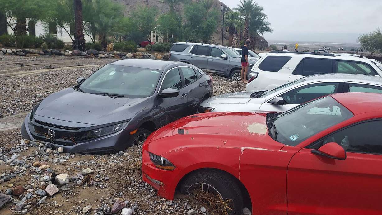 Cars are stuck in mud and debris from flash flooding at The Inn at Death Valley in Death Valley National Park, California, on Friday. Heavy rainfall triggered flash flooding that closed several roads in Death Valley National Park on Friday near the California-Nevada line.