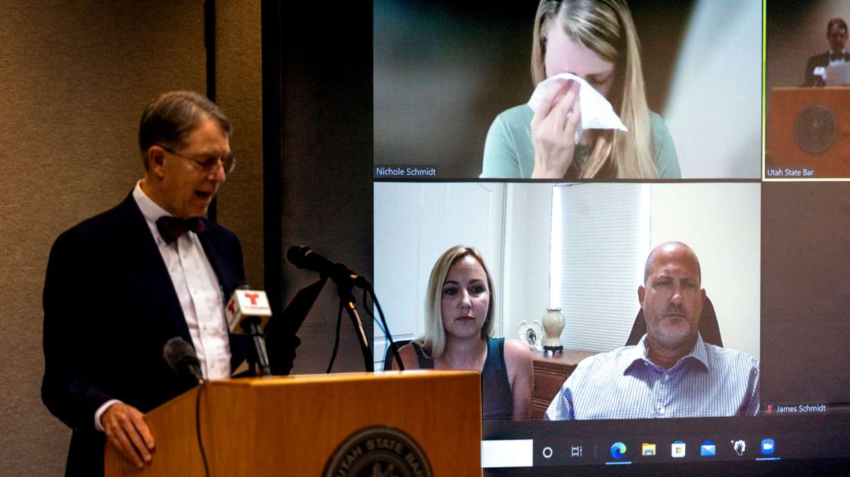Jim McConkie, of Parker & McConkie, stands at a podium while Joseph and Tara Petito, and Nicole and James Schmidt, parents of Gabrielle “Gabby” Petito, are projected on a screen via Zoom during a press conference at the Utah Law & Justice Center in Salt Lake City on Monday. The family of Gabby Petito announced an intent to file a $50 million wrongful death lawsuit against the Moab Police Department.