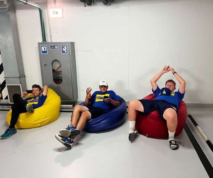 Teens from Idaho sit in a bunker near Makariv, Ukraine. They gifted new homes for several Ukrainian families.