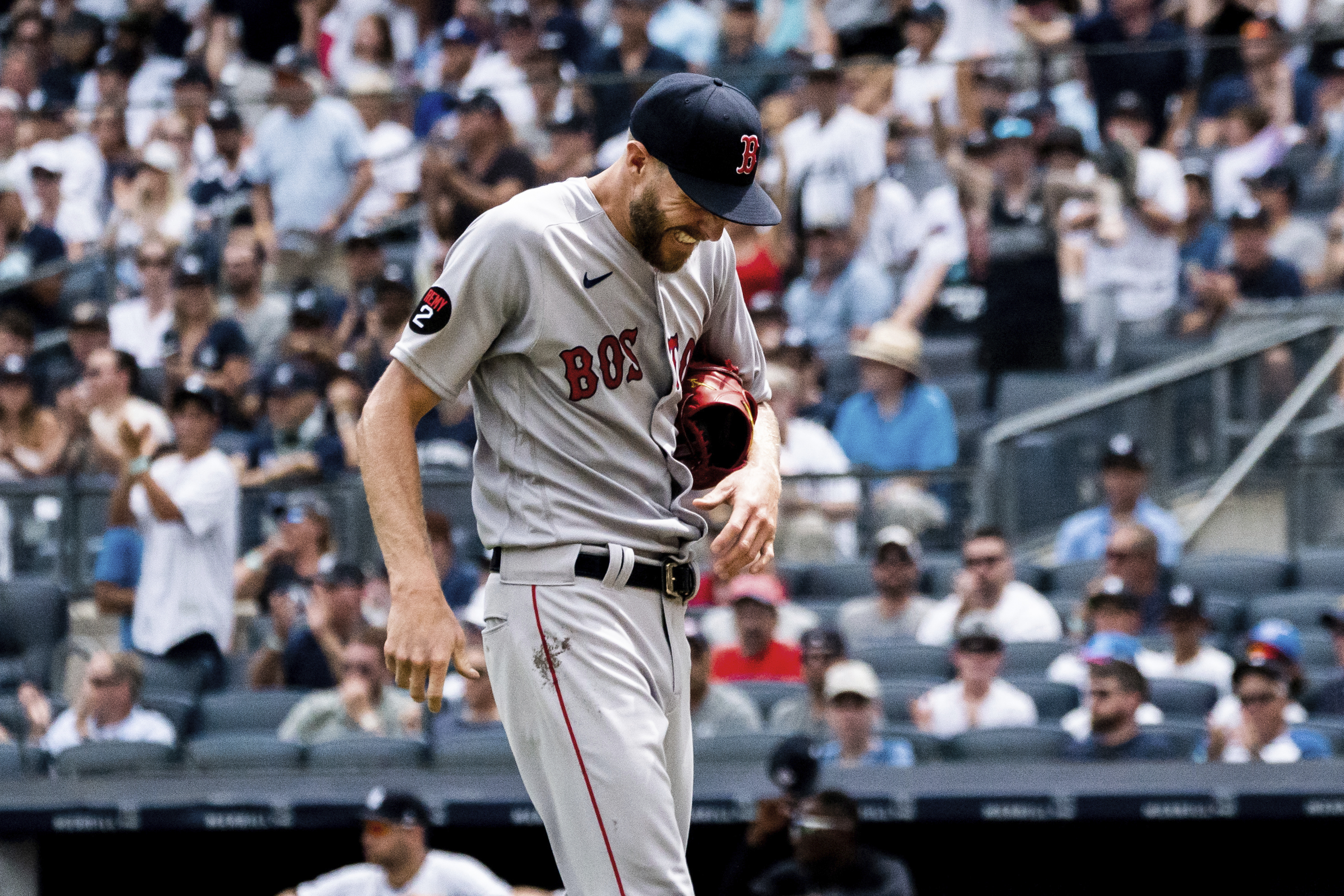 Boston Red Sox starting pitcher Chris Sale walks off the mound after a hand injury during the second inning of a baseball game against the New York Yankees, Sunday, July 17, 2022, in New York. 