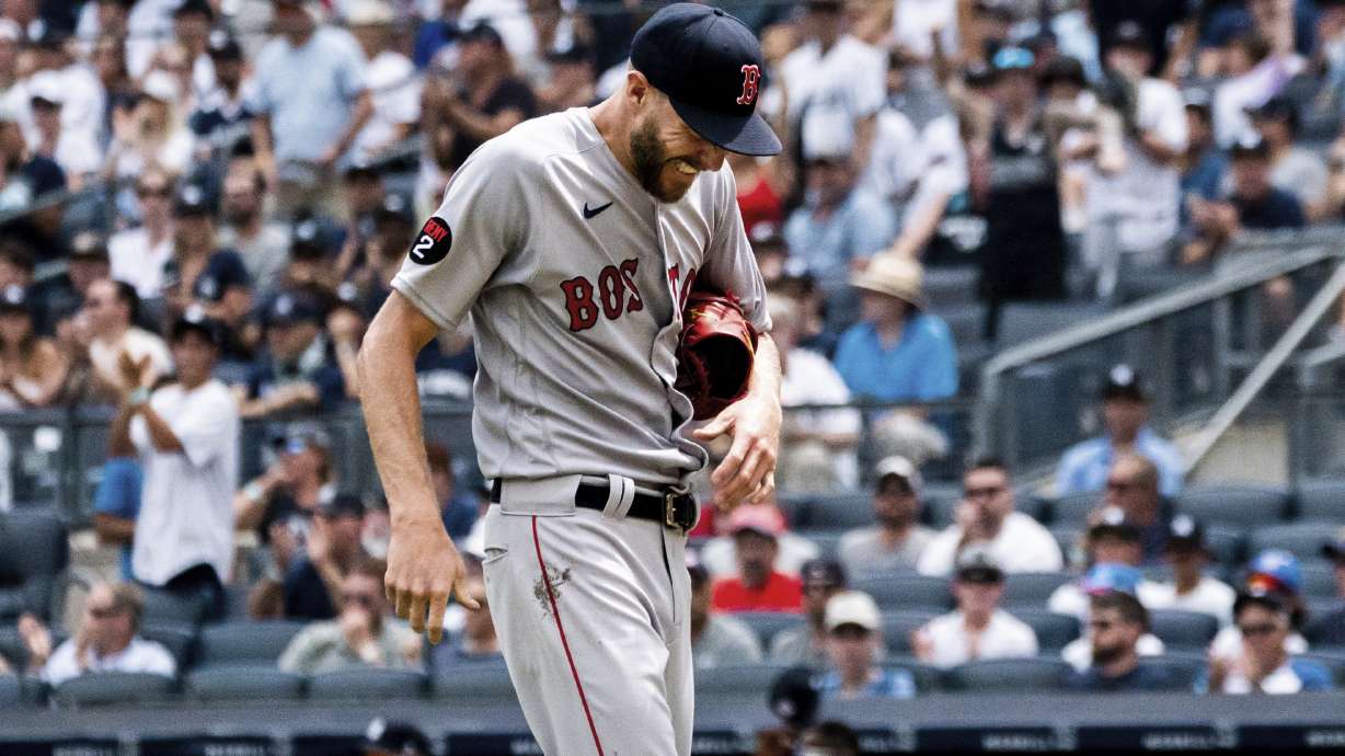 Boston Red Sox starting pitcher Chris Sale walks off the mound after a hand injury during the second inning of a baseball game against the New York Yankees, Sunday, July 17, 2022, in New York.