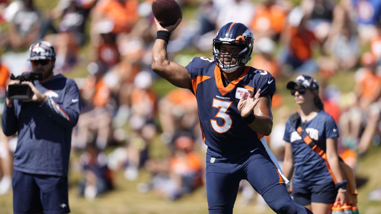 Denver Broncos quarterback Russell Wilson (3) takes part in drills during an NFL football training camp session at the team's headquarters Monday, Aug. 8, 2022, in Centennial, Colo.
