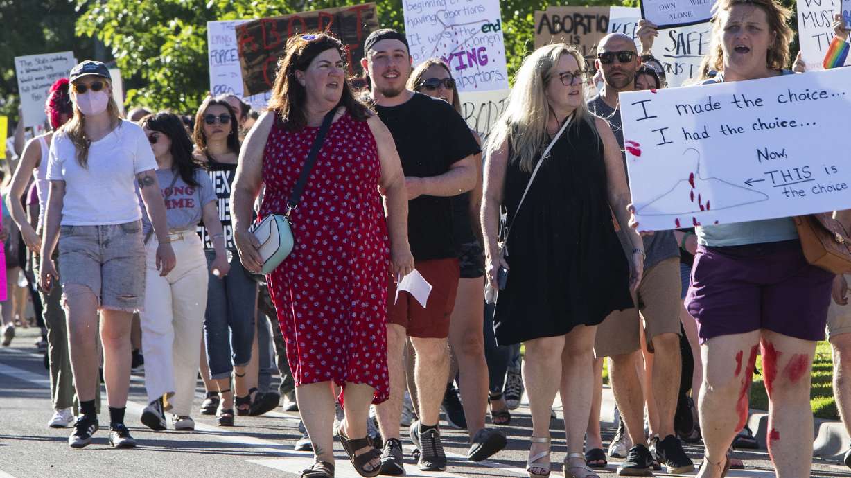 Protestors march through downtown Boise chanting pro-abortion rights slogans on their way to the Idaho Capitol steps, June 24 in Boise. The U.S. Department of Justice asked a federal judge this week to bar Idaho from enforcing its near-total abortion ban while a lawsuit pitting federal health care law against state anti-abortion legislation is underway.