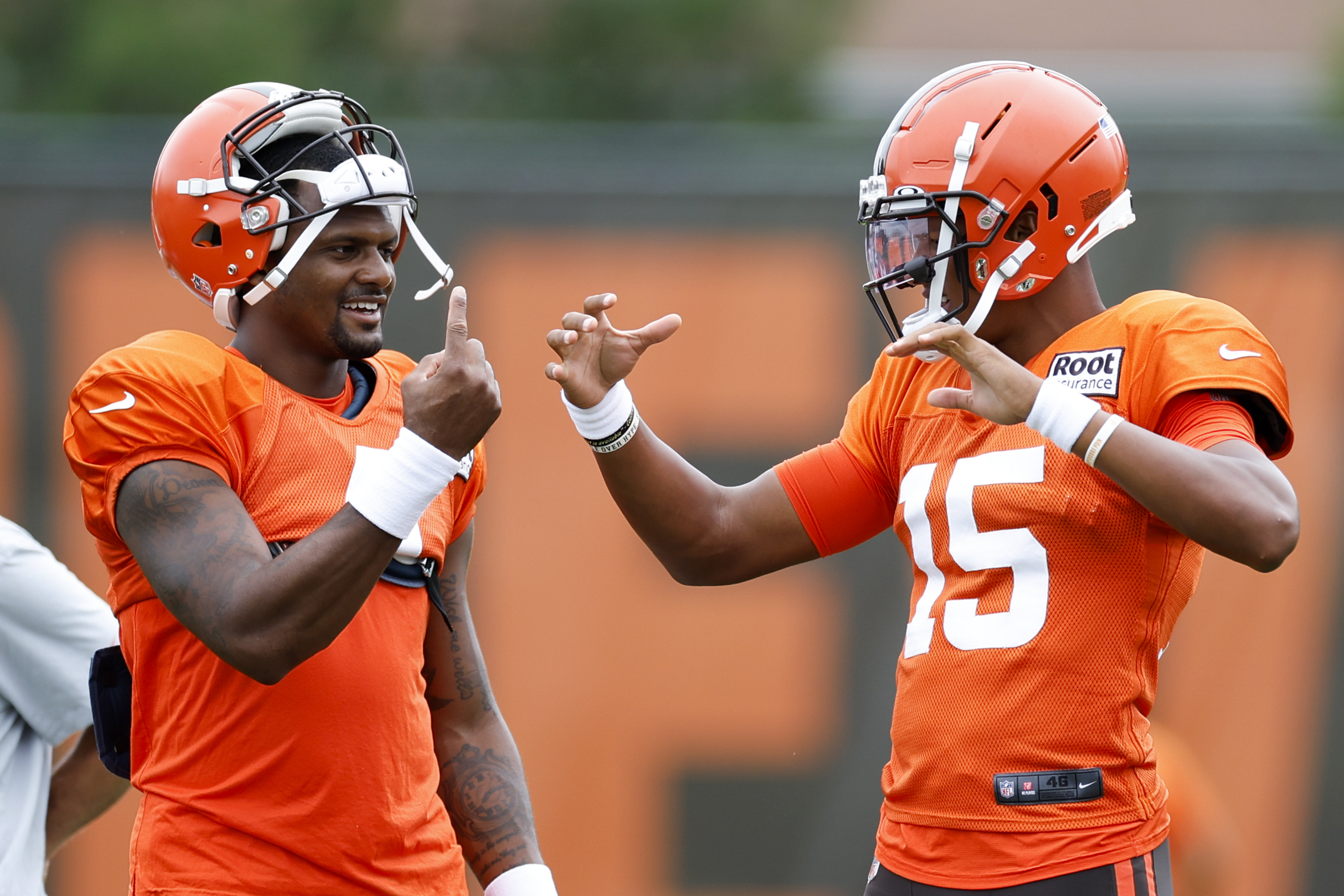 Cleveland Browns quarterback Deshaun Watson, left, talks with quarterback Joshua Dobbs during the NFL football team's training camp, Tuesday, Aug. 9, 2022, in Berea, Ohio. 