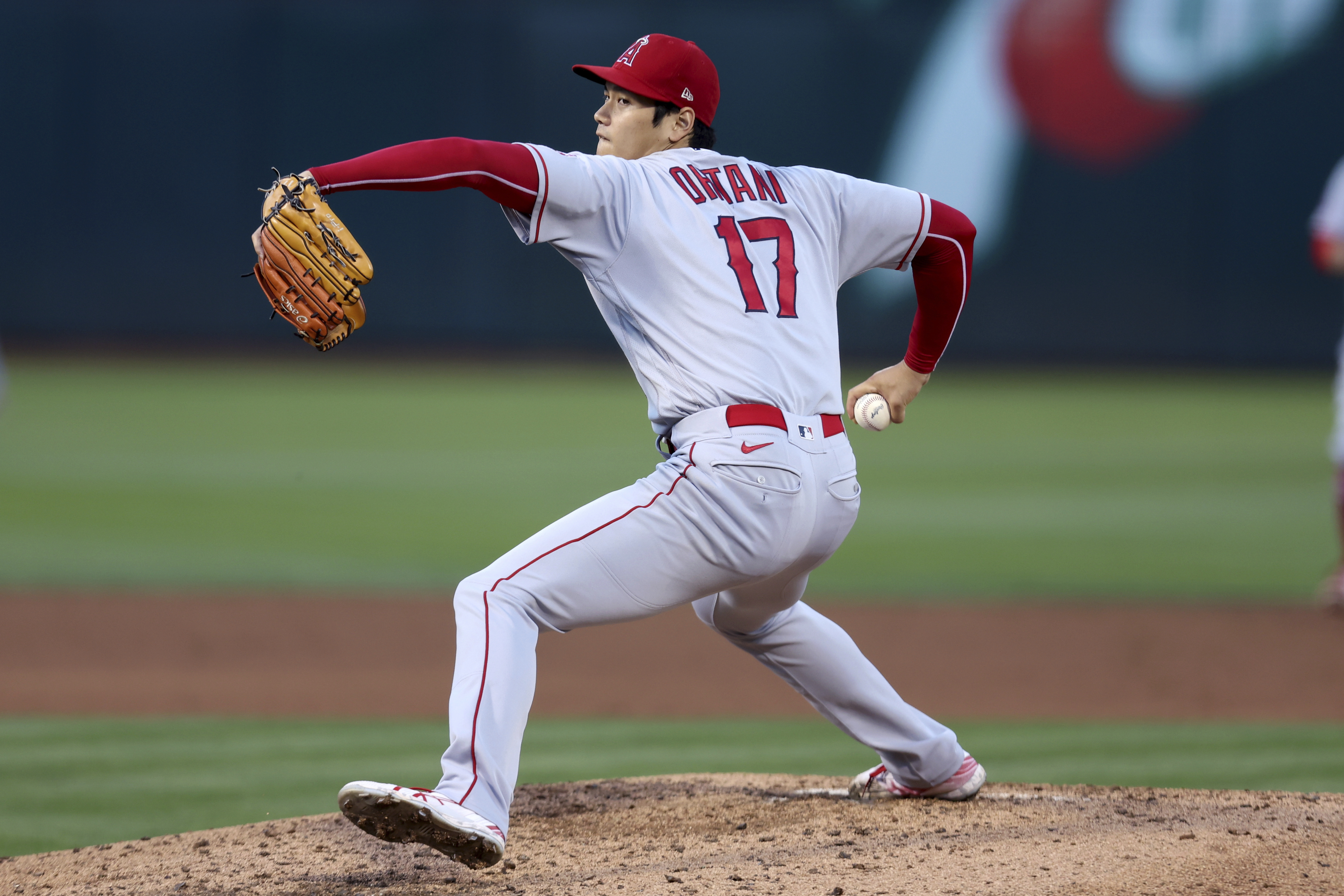 Los Angeles Angels starting pitcher Shohei Ohtani throws to an Oakland Athletics batter during the third inning of a baseball game in Oakland, Calif., Tuesday, Aug. 9, 2022.