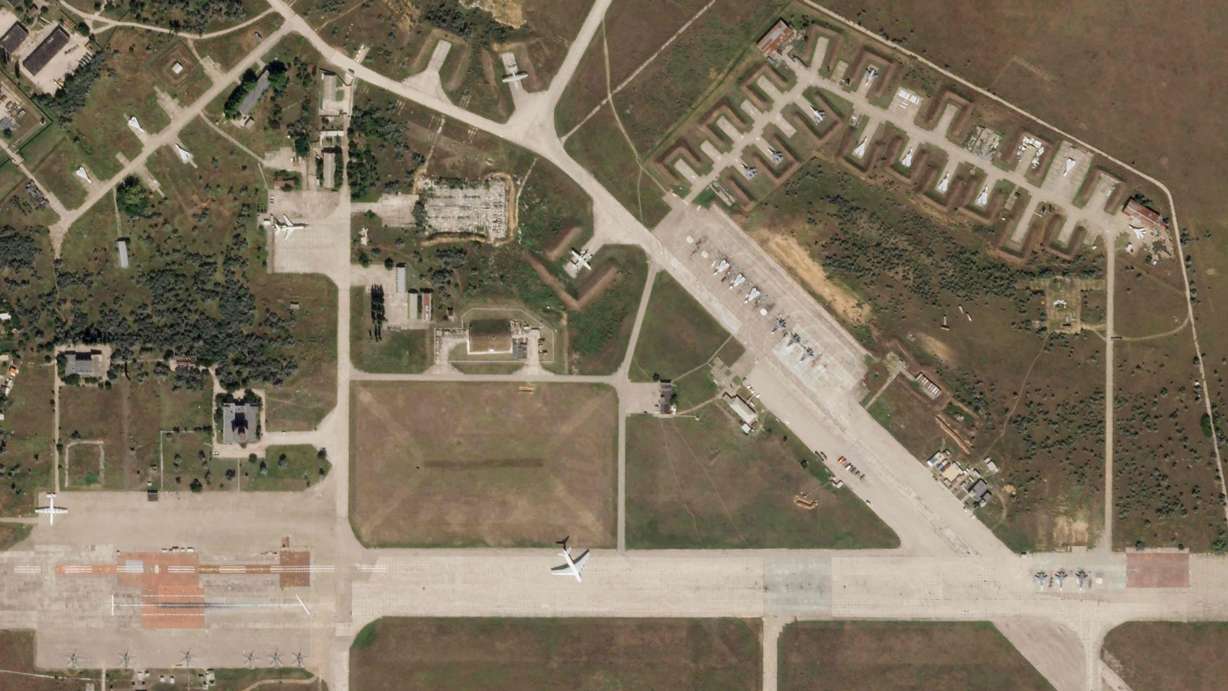 A satellite image shows aircraft at Saki Air Base before an explosion Tuesday, in the Crimean Peninsula, the Black Sea peninsula seized from Ukraine by Russia and annexed in March 2014. Powerful explosions rocked the Russian air base in Crimea and sent towering clouds of smoke over the landscape Tuesday.