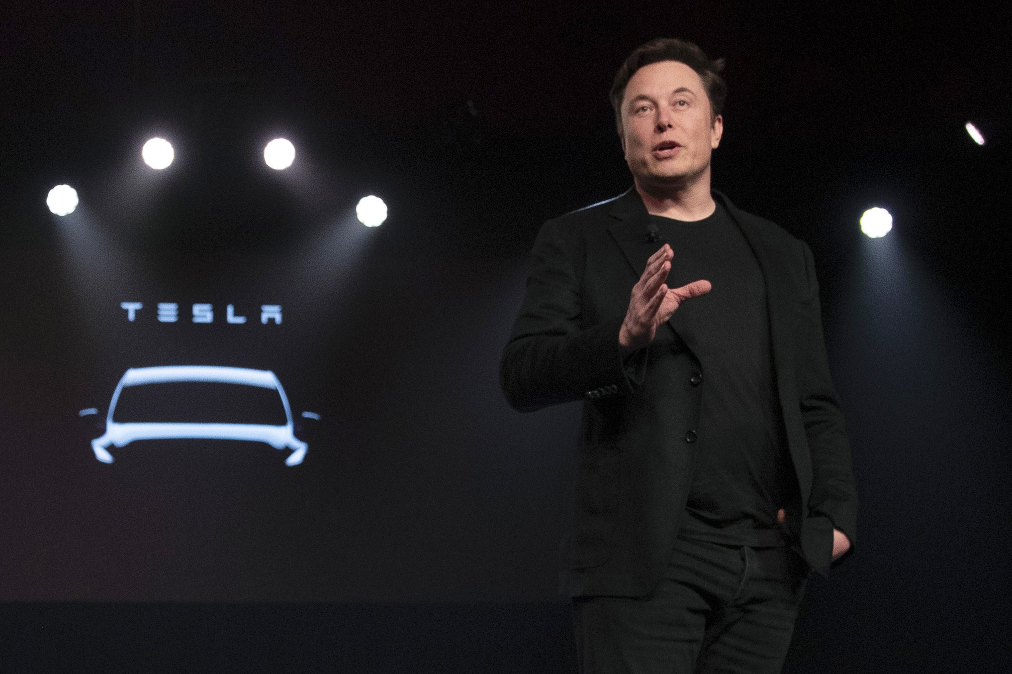 Tesla CEO Elon Musk speaks before unveiling the Model Y at the company's design studio on March 14, 2019, in Hawthorne, Calif. Musk is selling about 8 million Tesla shares worth nearly $7 billion as the billionaire looks to get his finances in order ahead of his court battle with Twitter.