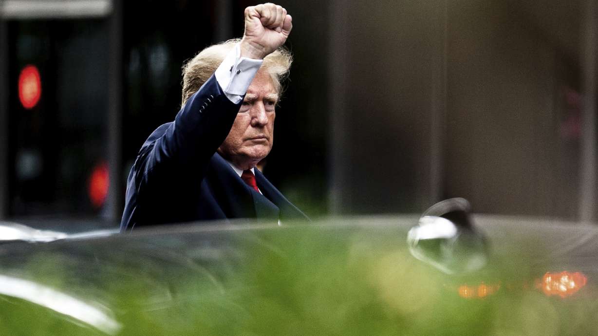 Former President Donald Trump gestures as he departs Trump Tower, Wednesday, in New York, on his way to the New York attorney general's office for a deposition in a civil investigation.
