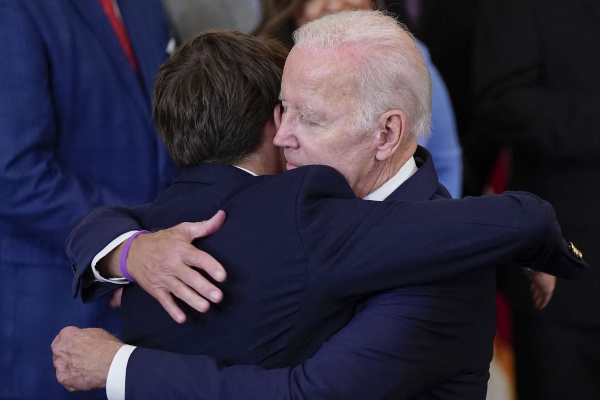President Joe Biden hugs his grandson Robert Biden, son of the late Beau Biden, after signing the "PACT Act of 2022" during a ceremony in the East Room of the White House, Wednesday, in Washington.