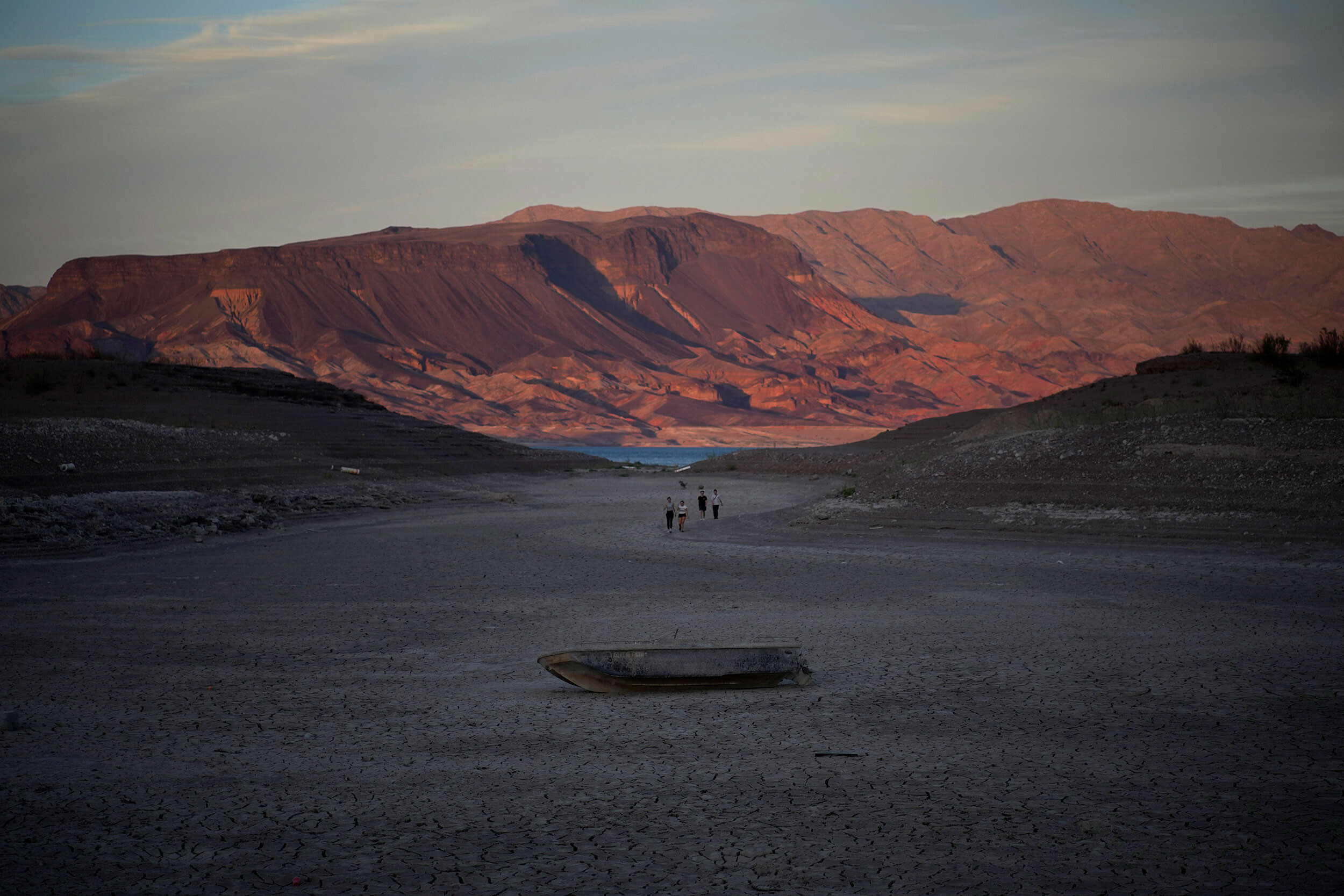 A formerly sunken boat sits on the dry lake bed of Lake Mead in May. Democrats' unprecedented climate bill would throw $4 billion to states in the West for drought relief, thanks to last-minute negotiations in the Senate.
