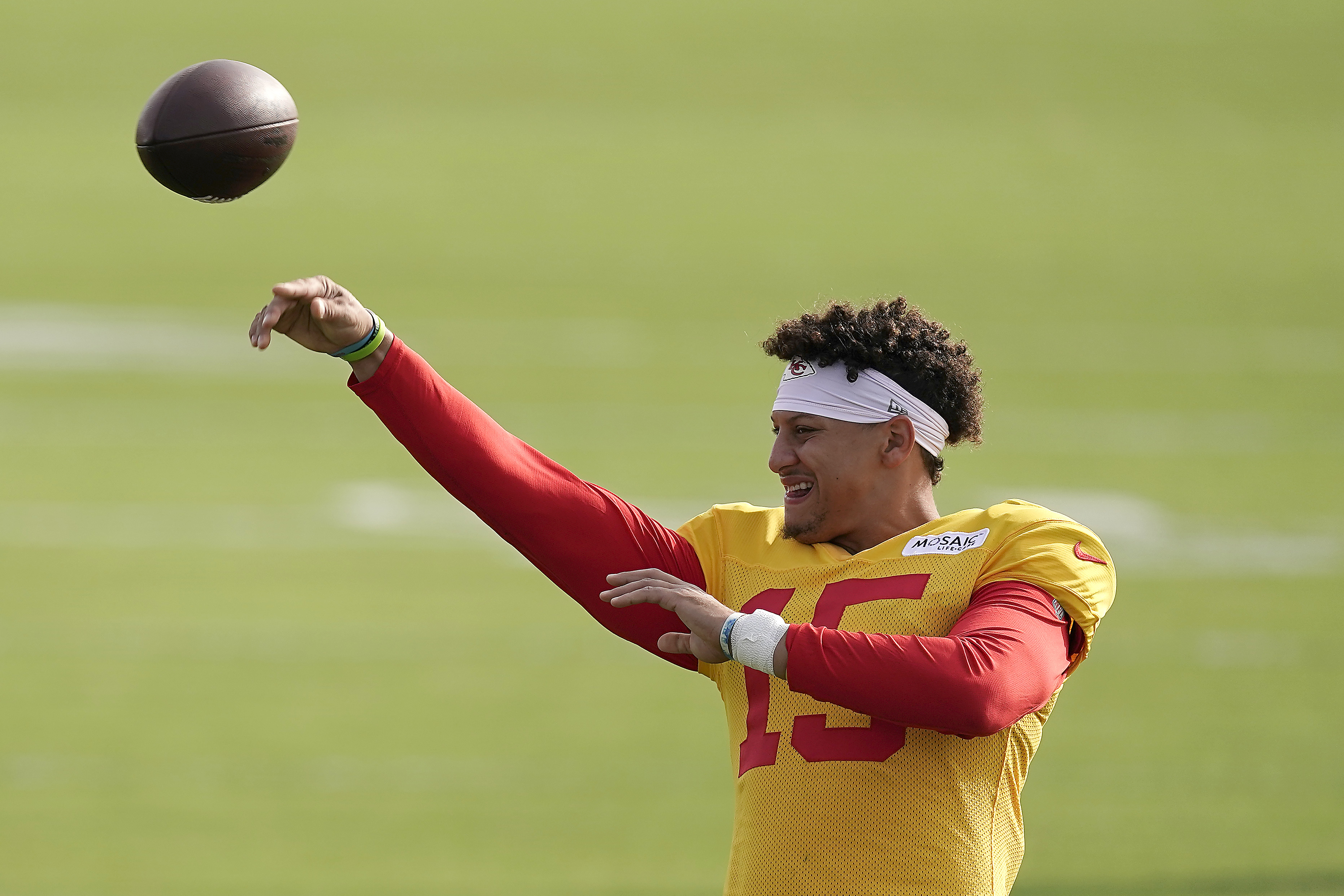 Kansas City Chiefs quarterback Patrick Mahomes passes during NFL football training camp Sunday, Aug. 7, 2022, in St. Joseph, Mo. 