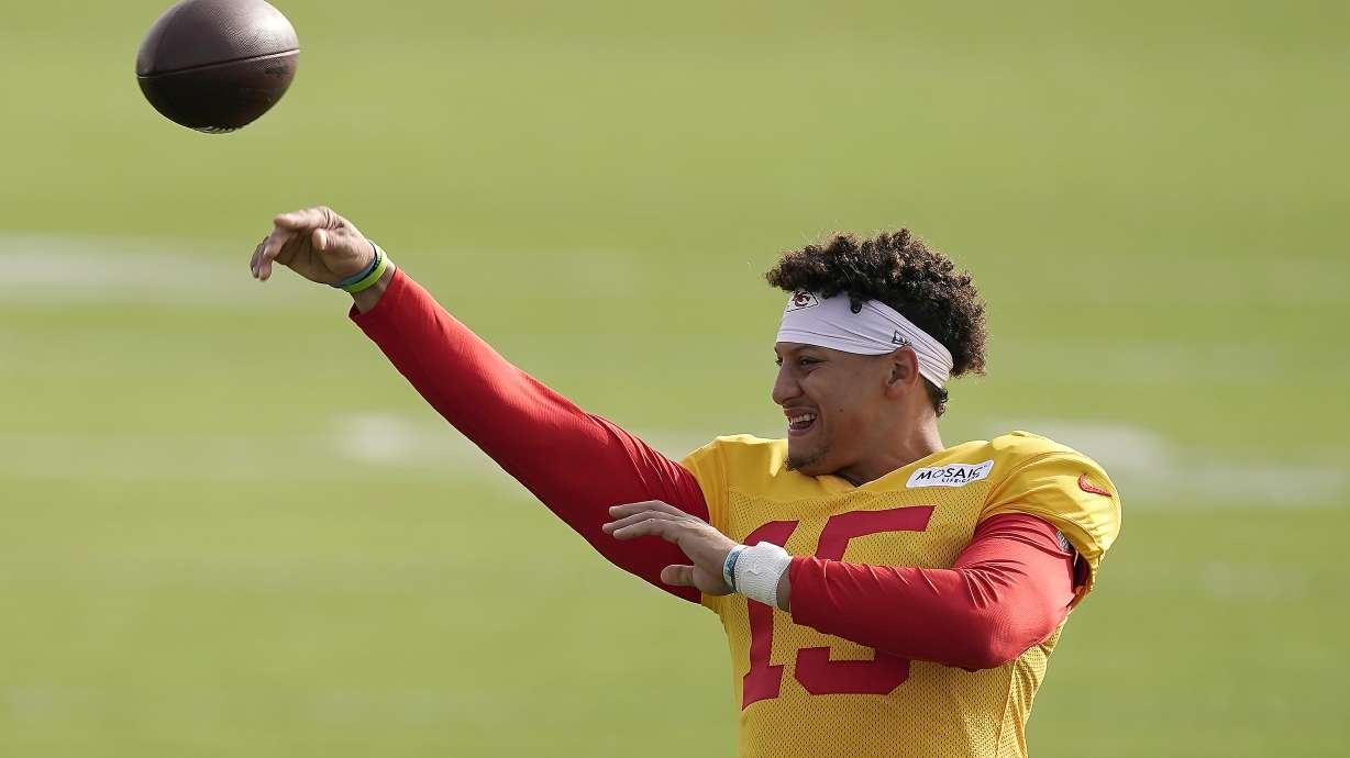 Kansas City Chiefs quarterback Patrick Mahomes passes during NFL football training camp Sunday, Aug. 7, 2022, in St. Joseph, Mo.