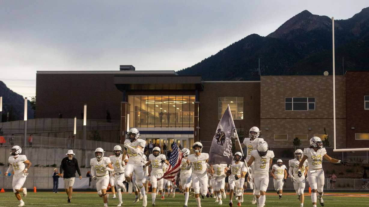 The Desert Hills storm the field before playing the Brighton Bengals in Cottonwood Heights on Thursday, Aug. 11, 2022. The Thunder overturned a 21-0 halftime deficit to stay unbeaten with a 31-28 win over Cedar Valley on Friday, Aug. 19, 2022.
