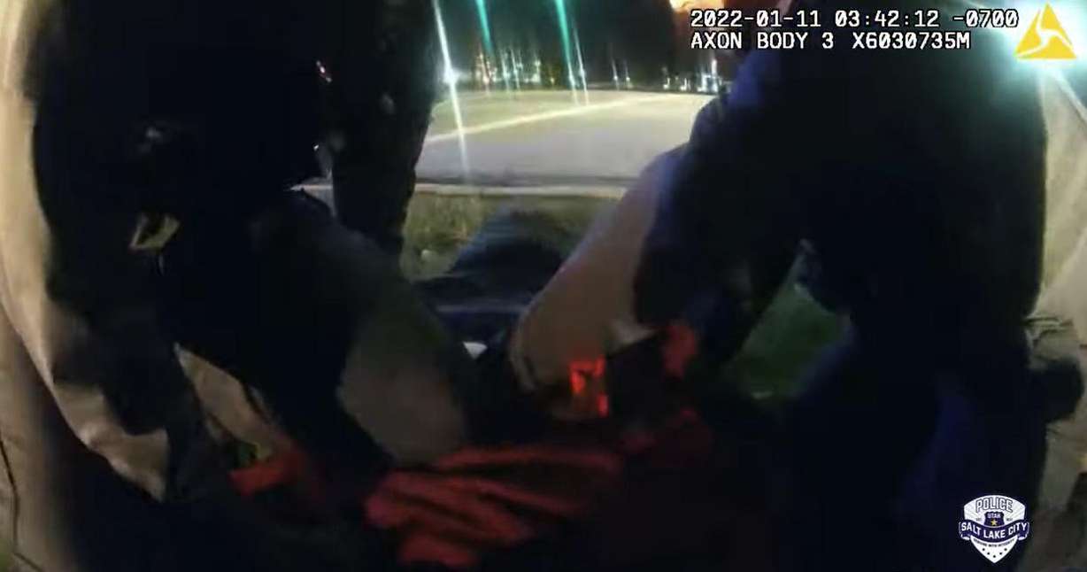 Salt Lake police officers restrain a woman in body camera video from Jan. 11 near 900 North and 400 West in Salt Lake City. Megan Joyce Mohn's death has since been ruled a homicide and is under investigation.