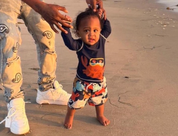 Police say they are looking for an 18-month-old boy whose parents "fled the state" after the father was suspected to be involved in the fatal shooting of a man during an alleged robbery attempt in May.