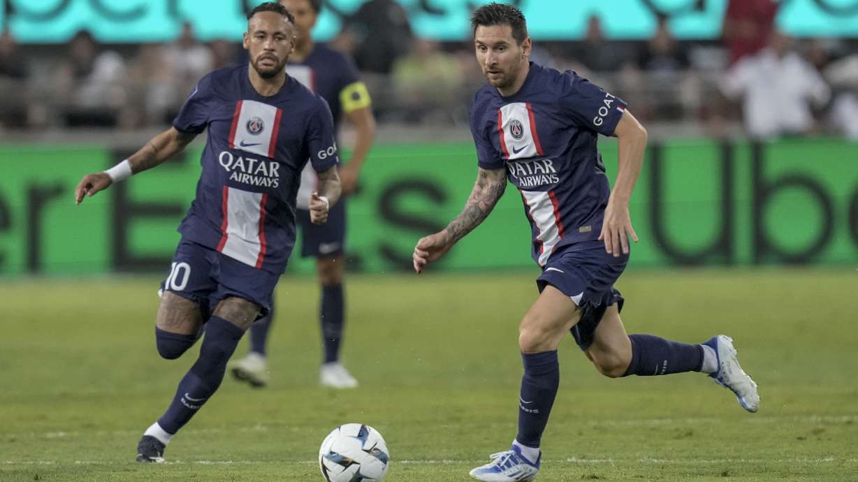 PSG's Lionel Messi, right, controls the ball as PSG's Neymar runs during the French Super Cup final soccer match between Nantes and Paris Saint-Germain at Bloomfield Stadium in Tel Aviv, Israel, Sunday, July 31, 2022.