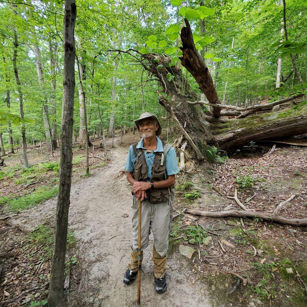 William H. “Marty” Martin poses for a picture at the Bull Run Mountains Preserve in Broad Run, Va., in July 2021. Martin, a respected snake researcher who had been making significant discoveries about the species since childhood, died Aug. 3, after being bitten the day before by a timber rattler.