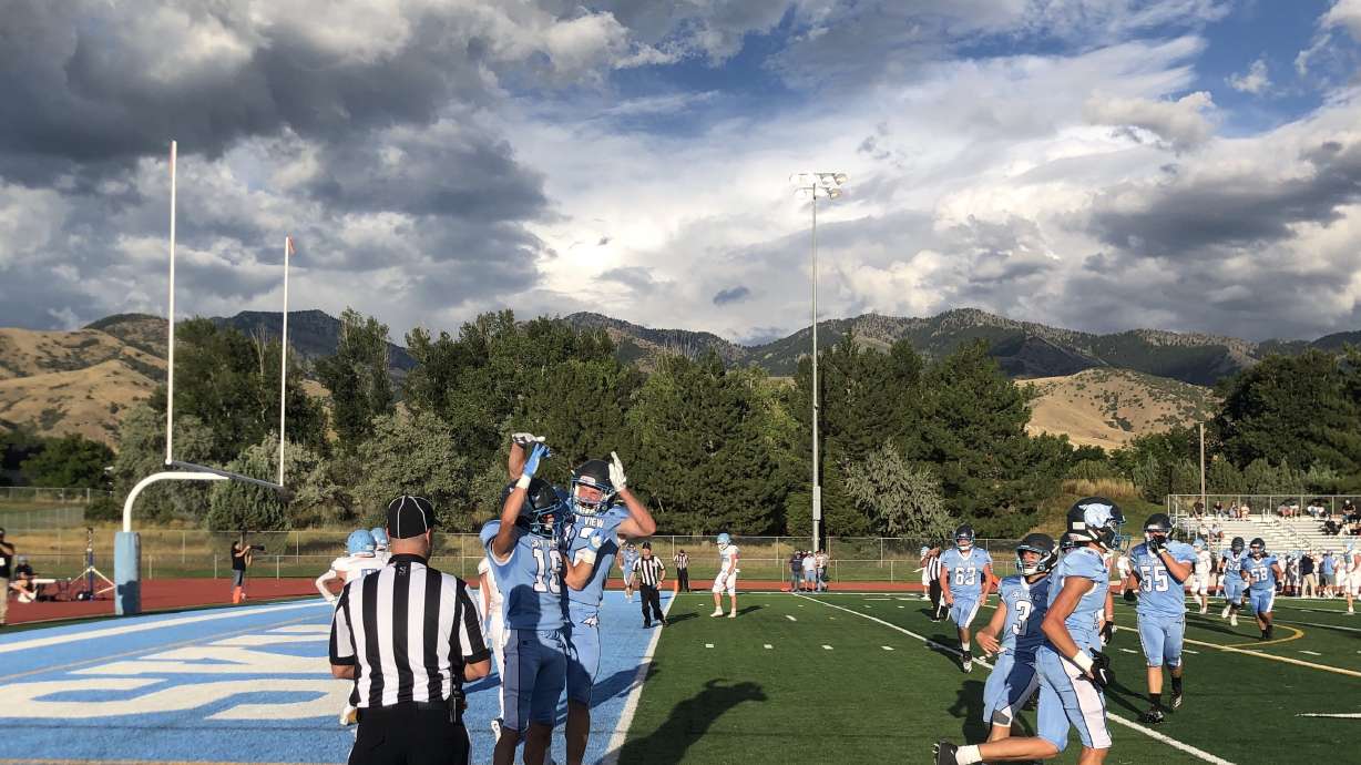 Sky View receiver Bryton Williams celebrates his first quarter touchdown catch with running back Jaxson Bradley.