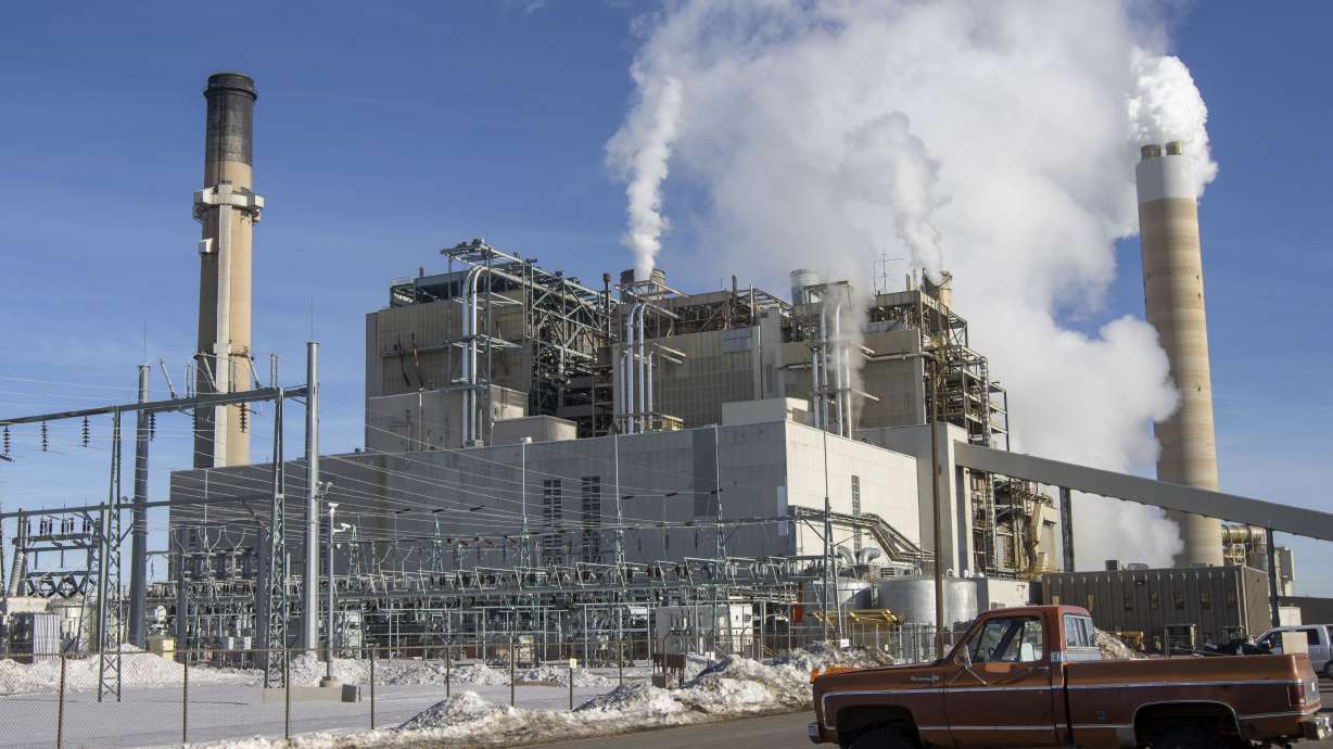 Carbon dioxide and other pollutants billows from stacks at the Naughton Power Plant, near where Bill Gates company, TerraPower plans to build an advanced, nontraditional nuclear reactor, on Jan. 12, in Kemmerer, Wyo. A major economic bill headed to the president has “game-changing” incentives for the nuclear energy industry, experts say, and those tax credits are even more substantial if a facility is sited in a community where a coal plant is closing.