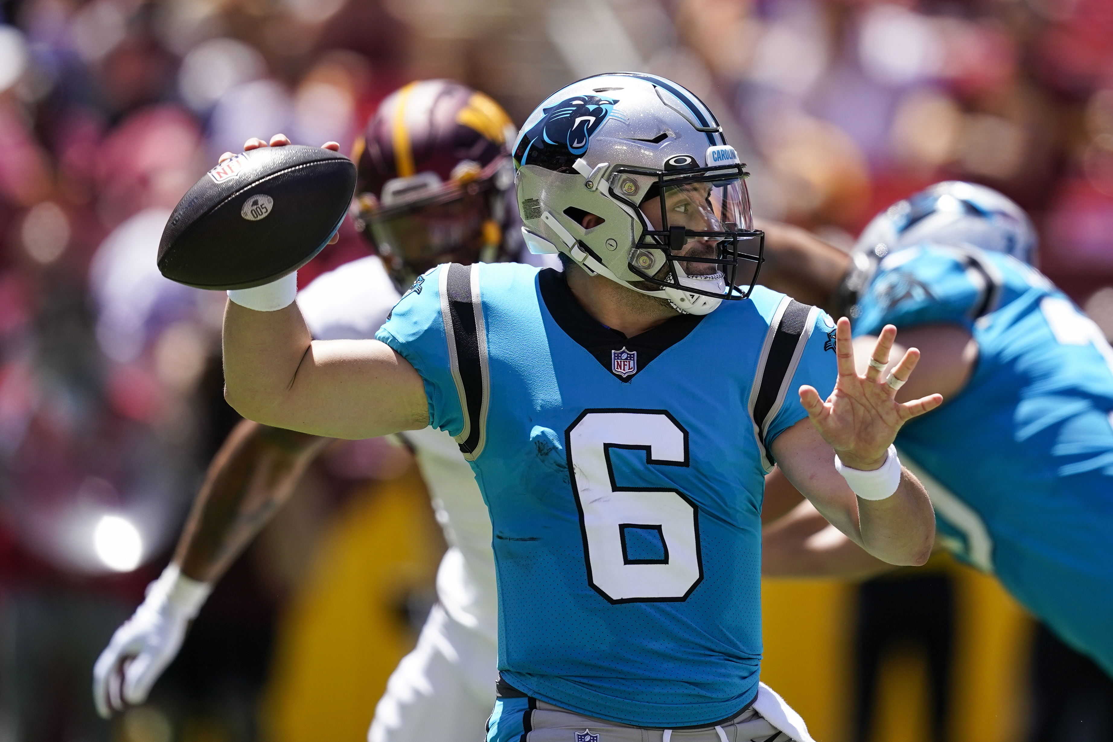 Carolina Panthers quarterback Baker Mayfield throws a pass during the first half of a NFL preseason football game against the Washington Commanders, Saturday, Aug. 13, 2022, in Landover, Md. 
