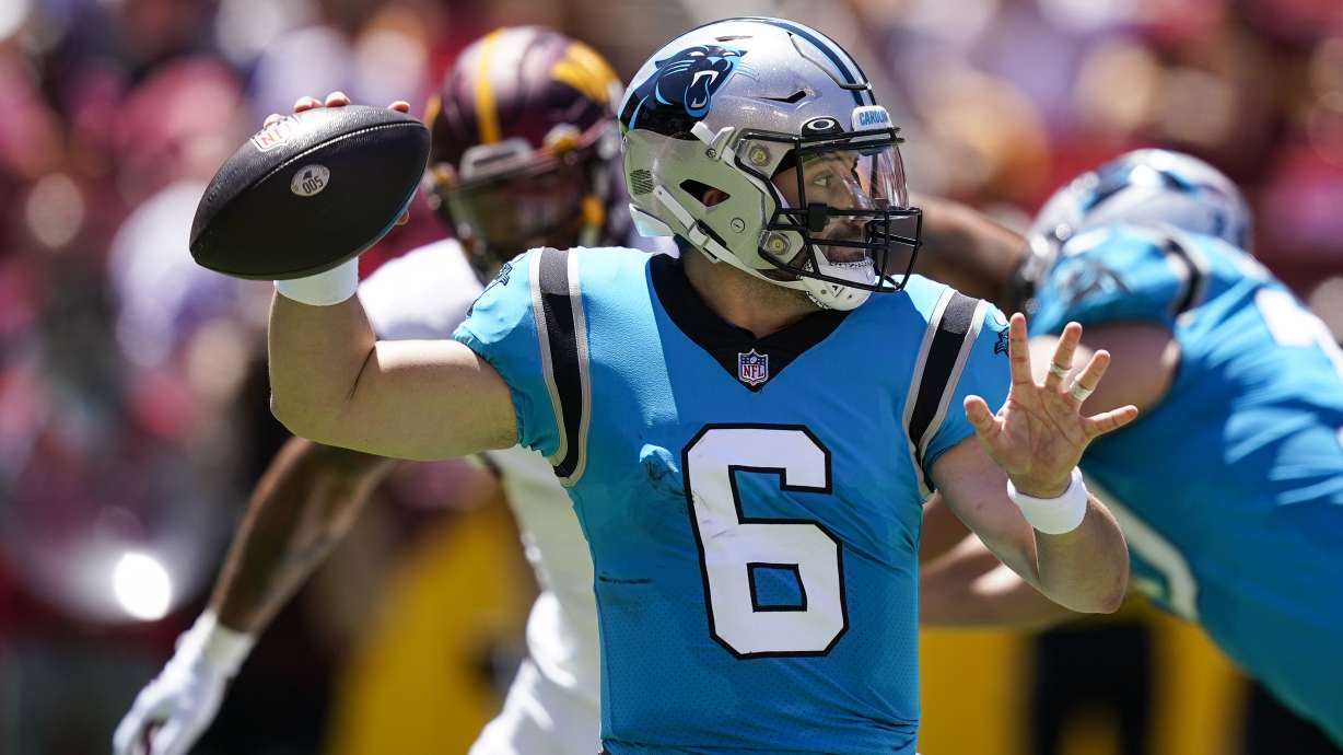 Carolina Panthers quarterback Baker Mayfield throws a pass during the first half of a NFL preseason football game against the Washington Commanders, Saturday, Aug. 13, 2022, in Landover, Md.