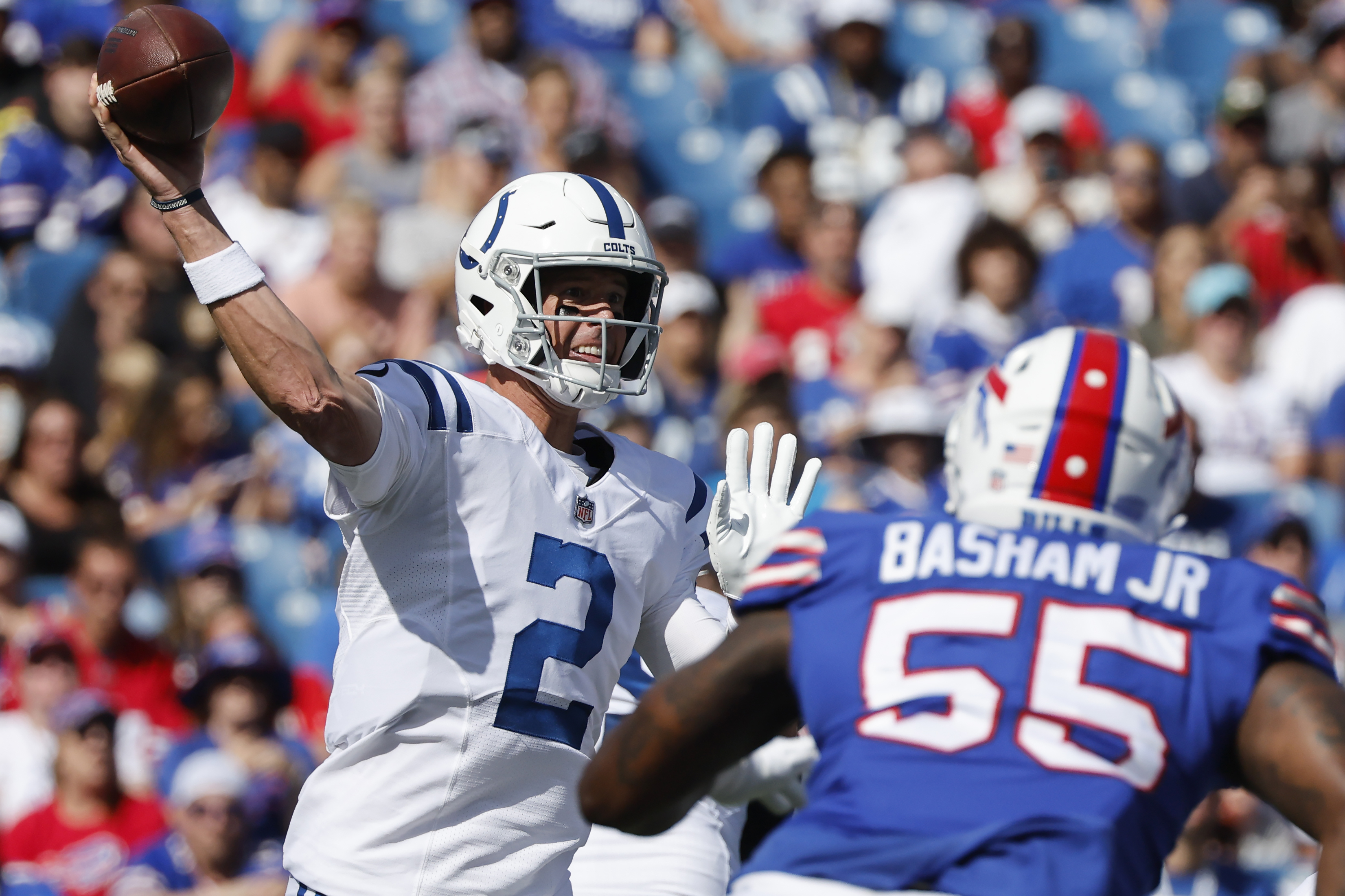 Indianapolis Colts quarterback Matt Ryan (2) passes under pressure from Buffalo Bills defensive end Boogie Basham (55) during the first half of a preseason NFL football game, Saturday, Aug. 13, 2022, in Orchard Park, N.Y.