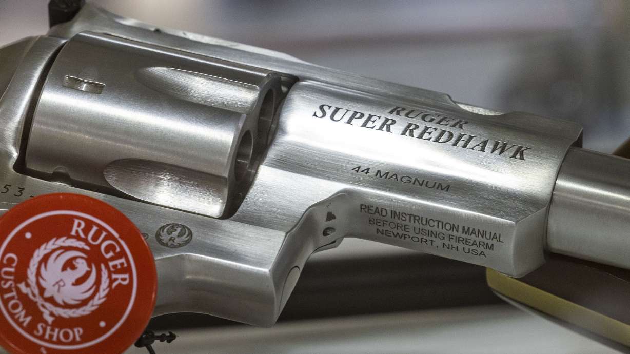 A Ruger Super Redhawk .44 Magnum sits in a display case at Impact Guns in South Salt Lake on July 6. More than half of all suicides in the state are by firearm.