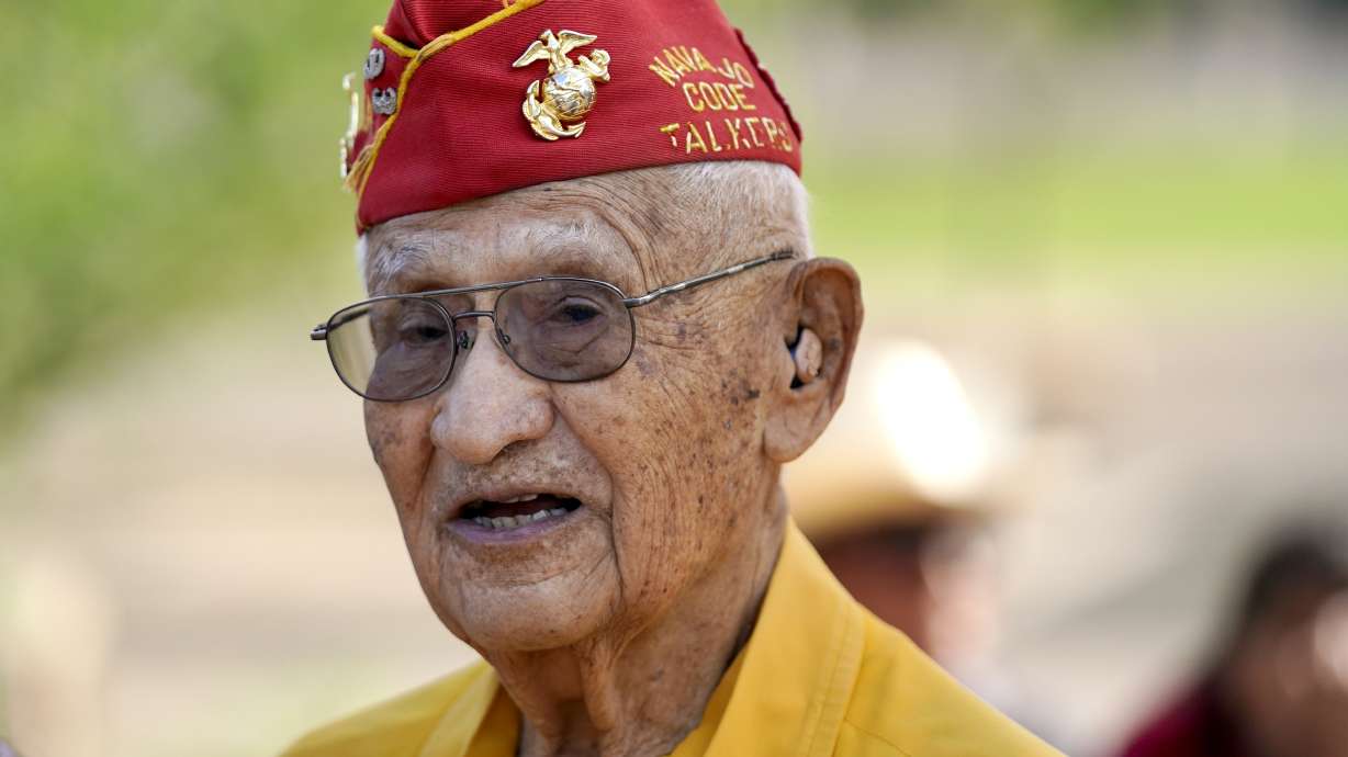 Navajo Code Talker Thomas Begay talks to people prior to the Arizona State Navajo Code Talkers Day celebration ceremony, Sunday, in Phoenix.