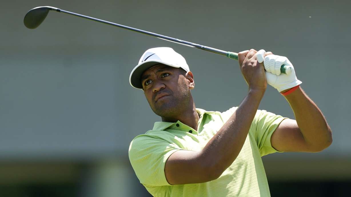 Tony Finau watches his shot off the sixth tee during the final round of the St. Jude Championship golf tournament, Sunday, Aug. 14, 2022, in Memphis, Tenn.