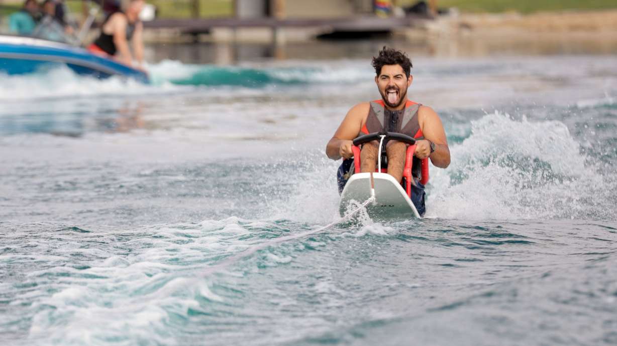 Eli Ulibarri, 27, gets towed on an adaptive water ski on Last Chance Lakes near Vernon, Tooele County, on July 14.