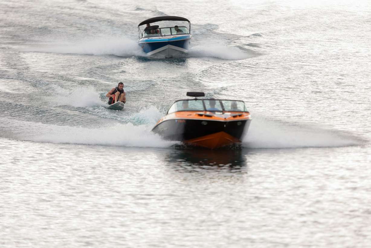 Brian Cone rides an adaptive water ski while a follow boat drives behind him on Last Chance Lakes near Vernon, Tooele County, July 14. The follow boat carries spotters who jump out when the rider falls over to help them stay upright in the water and restart the ride.