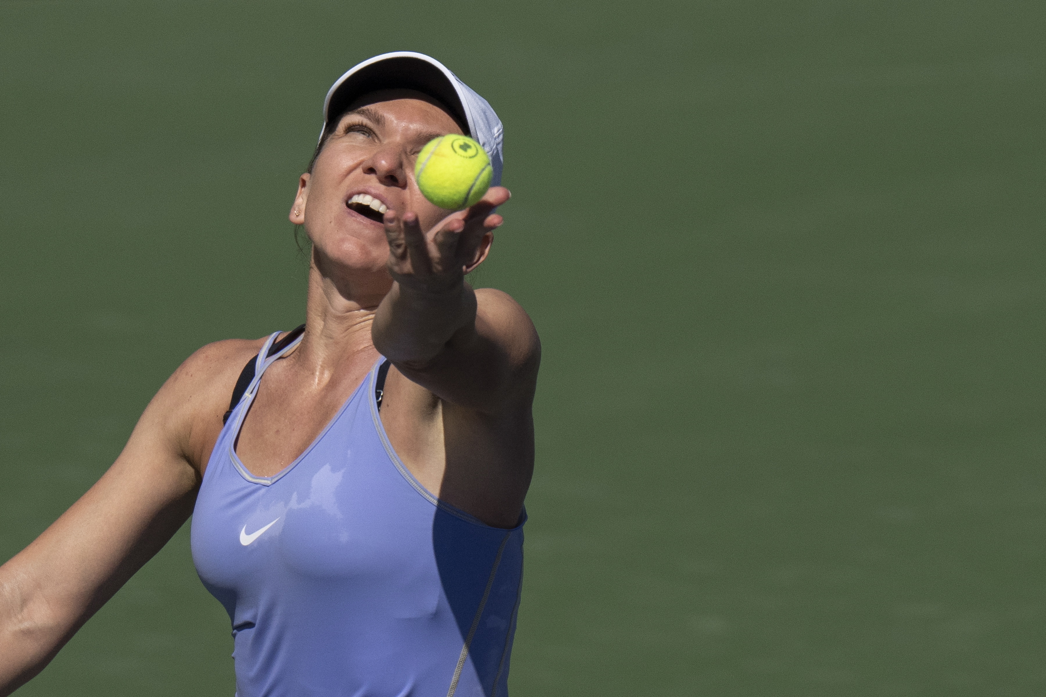 Simona Halep, of Romania, serves to Beatriz Haddad Maia, of Brazil, in the final of the National Bank Open tennis tournament in Toronto, Sunday, Aug. 14, 2022. 