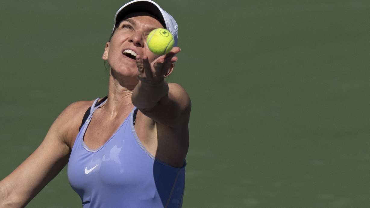 Simona Halep, of Romania, serves to Beatriz Haddad Maia, of Brazil, in the final of the National Bank Open tennis tournament in Toronto, Sunday, Aug. 14, 2022.