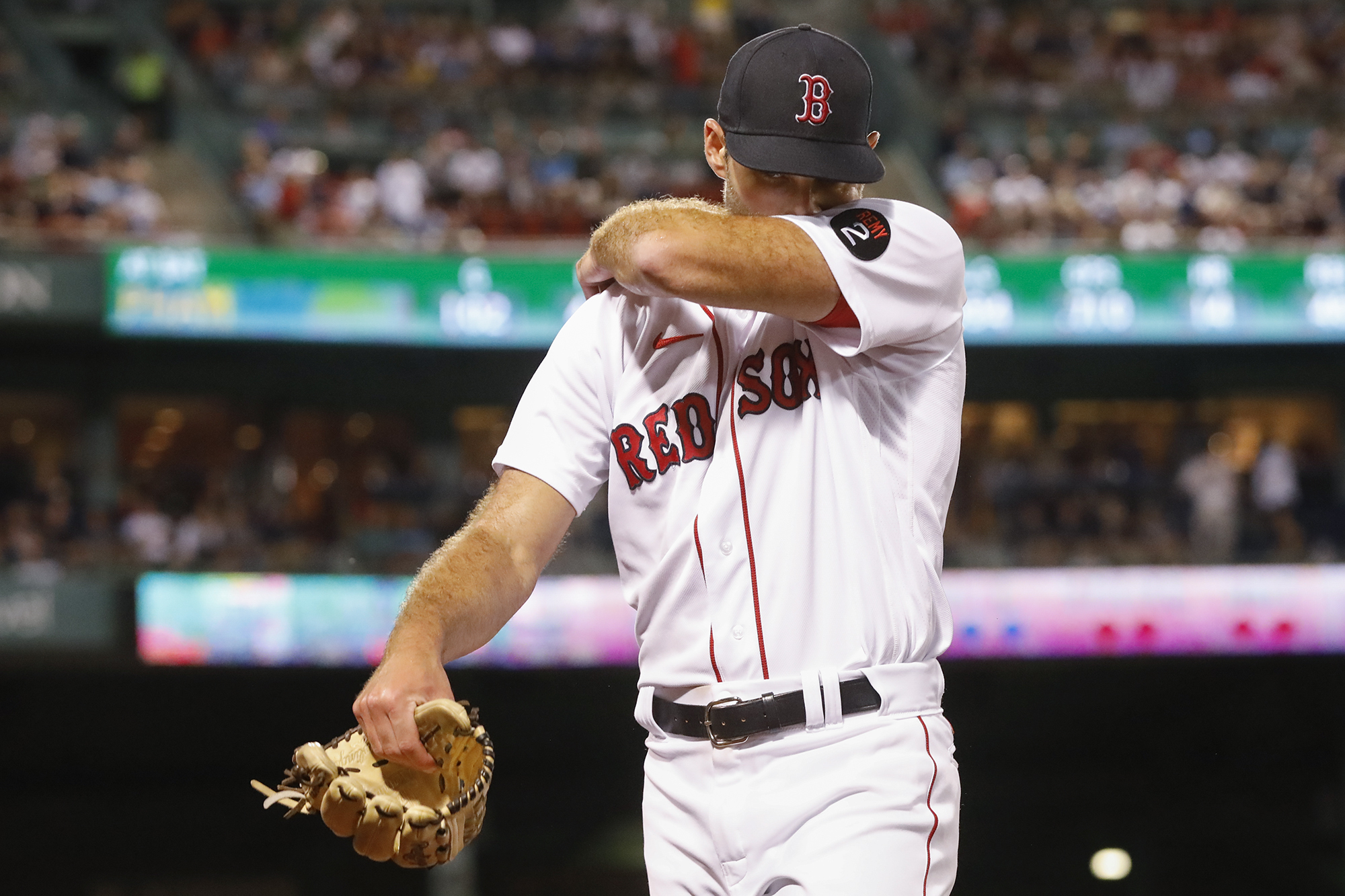 Boston Red Sox pitcher Michael Wacha wipes his face as he walks off the mound against the New York Yankees during the seventh inning at Fenway Park, Sunday, Aug. 14, 2022, in Boston. 