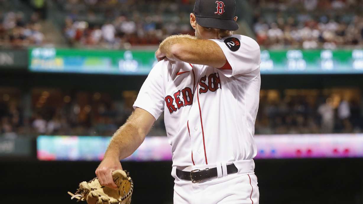 Boston Red Sox pitcher Michael Wacha wipes his face as he walks off the mound against the New York Yankees during the seventh inning at Fenway Park, Sunday, Aug. 14, 2022, in Boston.