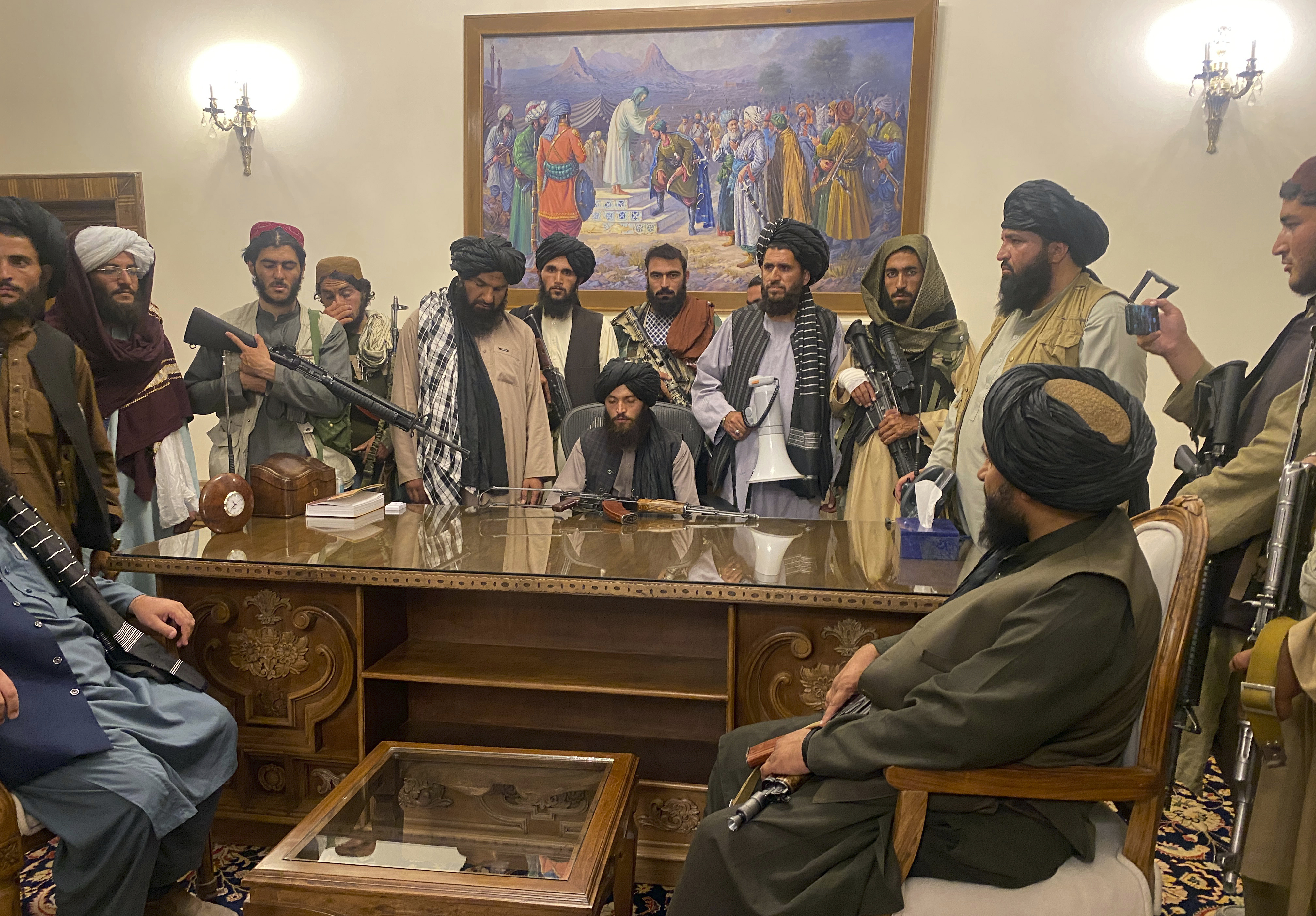 Taliban fighters take control of the Afghan presidential palace in Kabul, Afghanistan, after President Ashraf Ghani fled the country Aug. 15, 2021. Monday The Taliban are marking a year since they seized the Afghan capital.
