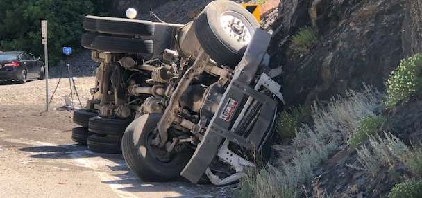 Judge orders dump truck driver to stand trial in fatal crash, dismisses charges for truck's owner