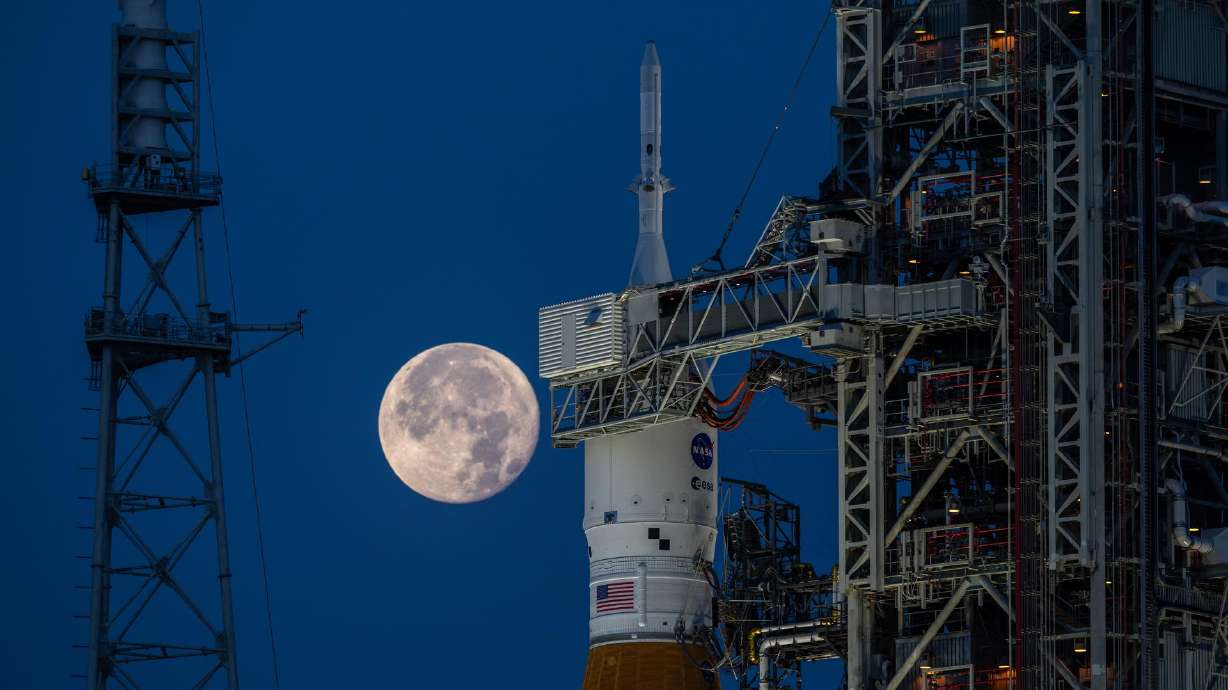 A full moon is in view from Launch Complex 39B at NASA’s Kennedy Space Center in Florida on June 14. While no human crew will travel aboard NASA's Artemis I mission, that doesn't mean the Orion spacecraft will be empty.