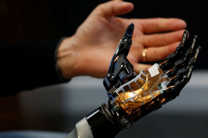 Covvi Group CEO Simon Pollard holds the bionic hand developed by Covvi, at Quayside Business Park in Leeds, Britain, on Aug. 11.