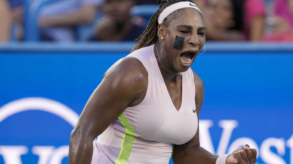 Serena Williams, of the United States, reacts after winning a point against Emma Raducanu, of Britain, during the Western & Southern Open tennis tournament Tuesday, Aug. 16, 2022, in Mason, Ohio.